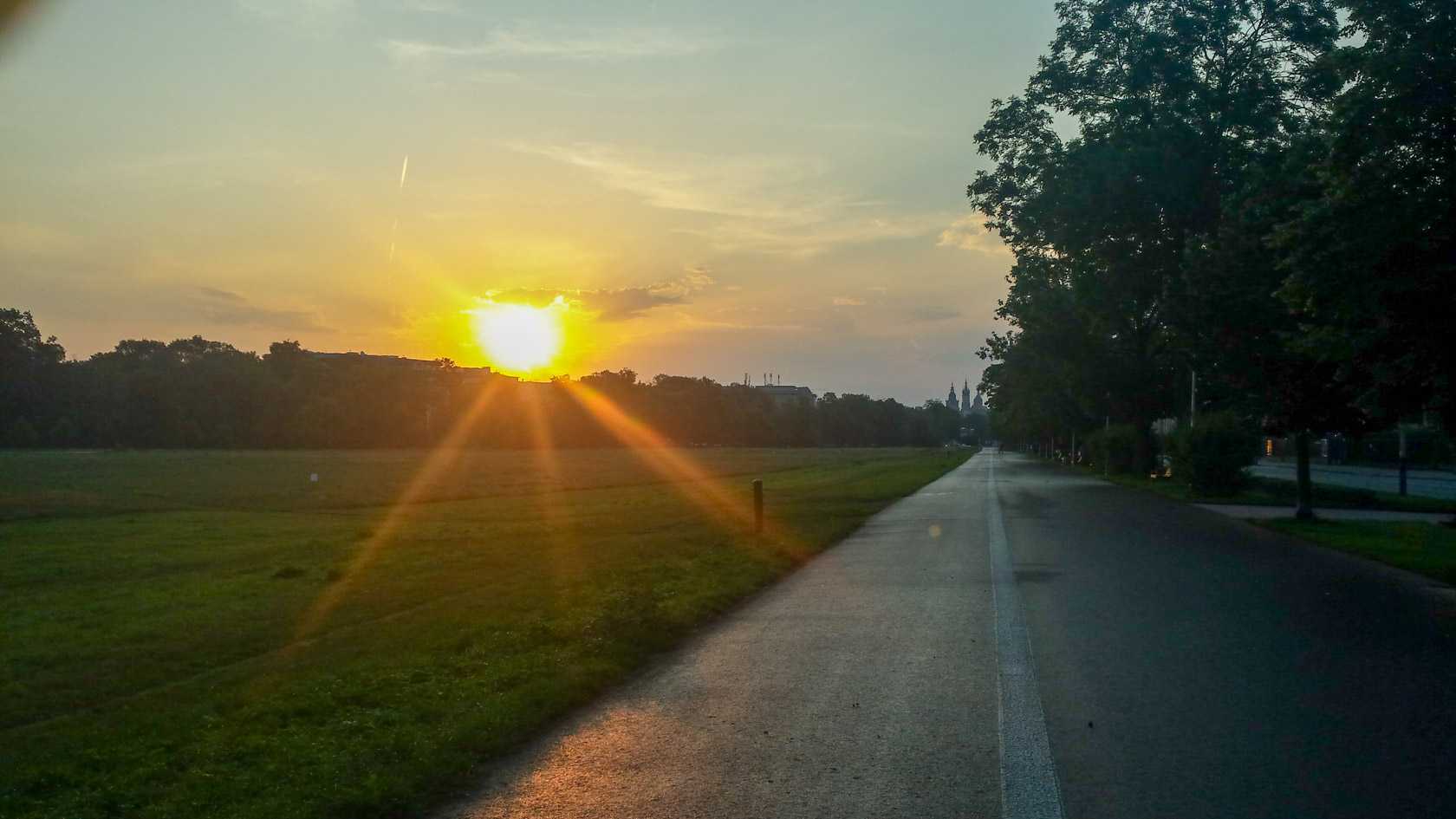 Sunset over the Błonia meadow path, Kraków