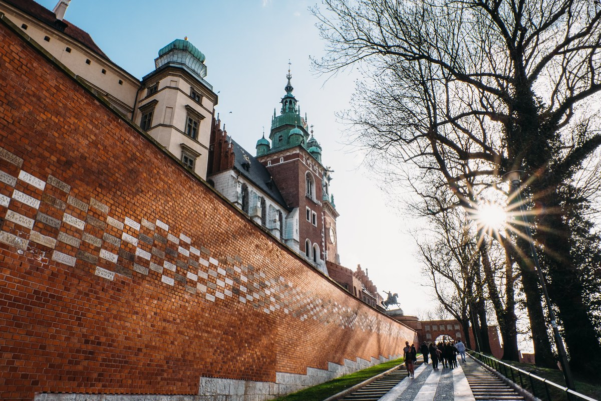 The brick approach to Wawel Castle at golden hour, Kraków